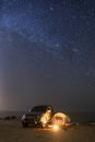 Camping at night under a sky full of stars