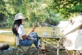 Camping outdoor. Asian women camping leisure and destination travel near waterfall. Royalty Free Stock Photo