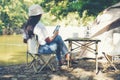 Camping outdoor. Asian women camping leisure and destination travel near waterfall. Royalty Free Stock Photo