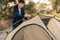 Camping people outdoor summer lifestyle tourists. boy installing tent. Natural children