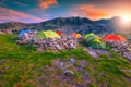 Camping place with colorful tents at sunset, Retezat mountains, Romania Royalty Free Stock Photo