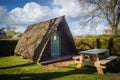 Camping pod with green door at Pennine View campsite in Kirkby Stephen