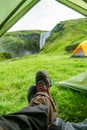 Camping site with tents in front of famous Skogarfoss waterfall, while hiking in Iceland, summer Royalty Free Stock Photo