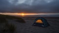 Camping spot in the low sun at the ocean shores Royalty Free Stock Photo