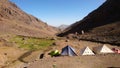 Camping spot with tents in front of Refuge Toubkal Les Mouflons, in Atlas Mountains Royalty Free Stock Photo