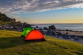 Camping at sunset with tents on Uttakleiv beach in Lofoten islands, Norway