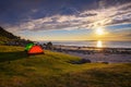 Camping at sunset with tents on Uttakleiv beach in Lofoten islands, Norway