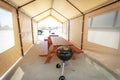 Camping table and chairs in tent