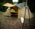 Camping tend in forest, in Dolomiti mountains, noth Italy Royalty Free Stock Photo