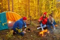 Camping tent camp in nature happy caucasian friends in autumn at nature forest, hike Royalty Free Stock Photo