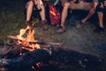 Camping tent camp in nature happy friends group night party bonfire and playing guitar together Royalty Free Stock Photo