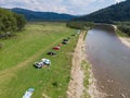 camping tent with car near mountains river Royalty Free Stock Photo