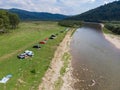 camping tent with car near mountains river