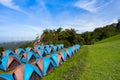 Camping tent on green grass field at hill Royalty Free Stock Photo