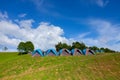 Camping tent on green grass field under clear sky Royalty Free Stock Photo