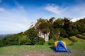 Camping tent on green grass field under clear sky Royalty Free Stock Photo