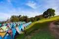 Camping tent on green grass field under clear sky Royalty Free Stock Photo