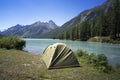 Camping tent with lake background. rest or vacation in the wild in Siberia in Altai. outdoor activity. the concept of Hiking Royalty Free Stock Photo