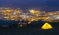 Camping tent at night with the lights of the city in the background, Irun in Euskadi Royalty Free Stock Photo