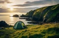 Camping tent by the sea at sunrise