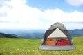 Camping tent with sleeping bags in mountains on day Royalty Free Stock Photo