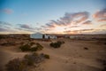 Camping tents and campfire in the middle of the Moroccan Sahara