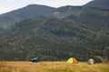 Camping tents in mountains on sunny day Royalty Free Stock Photo