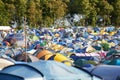 Camping, tents and outdoor music festival in park, field with trees or forest in summer. Camp, site and shelter at party