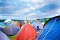 Camping, tents and outdoor music festival in park on holiday or vacation in summer. Camp, site and shelter setup at