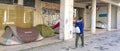 camping tents under the arches of residential and service buildings in a commercial area on Avenida Almirante Reis in Lisbon