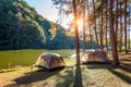 Camping tents under pine trees with sunlight at Pang Ung lake, Mae Hong Son in THAILAND