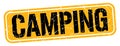 CAMPING text written on orange-black stamp sign