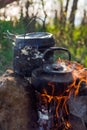 Camping and tourist equipment. For breakfast and dinner on a hike. Cooking food at the stake. Crockery in the campaign. Meal at th Royalty Free Stock Photo