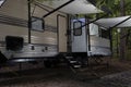 Camping trailer with awnings extended