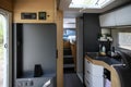 Camping in trailer, rv kitchen and bedroom, nobody. Mobile kitchen and wardrobe in the camper. Life in a mobile home.
