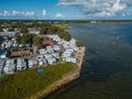 camping with trailers and campers at sea shore with beach, campsite aerial view