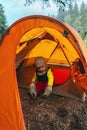 Camping vacations child in tent outdoor gear family travel adventure hiking