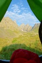 Camping with a view on Chaukhi mountain pass from Abudelauri Green Lake in Caucasus mountains, Georgia