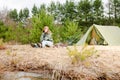 Camping woman tent sitting fire nature