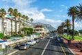 Camps Bay, upmarket suburb of Cape Town, South Africa, looking down the main road at shops, restaurants and apartment buildings on