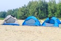 Campsite on beach. Tents on sea beach with sky and green background. Tent on the beach, Bay area day trip activities.