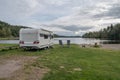 campsite camping caravan by lake Ragnerudssjoen in Dalsland Sweden beautiful nature forest pinetree Royalty Free Stock Photo