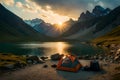 A campsite nestled in a mountain valley, with a clear stream flowing by and a backdrop of rugged peaks