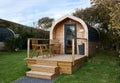 Campsite pods in a field. Royalty Free Stock Photo