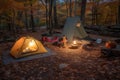 campsite with tent, lantern, and campfire for a warm and cozy stay