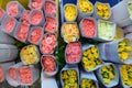 Coloured rose blossoms in flower market in India