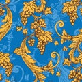 Seamless pattern with bunches of grapes. Golden ornament on a blue background in vintage style.