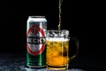 Can of Beck`s or Becks beer and beer glass on dark background. Illustrative editorial photo shot in Bucharest, Romania, 2021