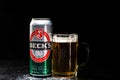 Can of Beck`s or Becks beer and beer glass on dark background. Illustrative editorial photo shot in Bucharest, Romania, 2021