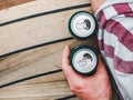Can of beer and male hand. Top view Royalty Free Stock Photo